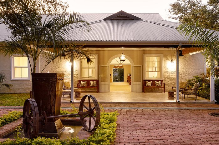 Entrance to a luxury safari lodge at dusk