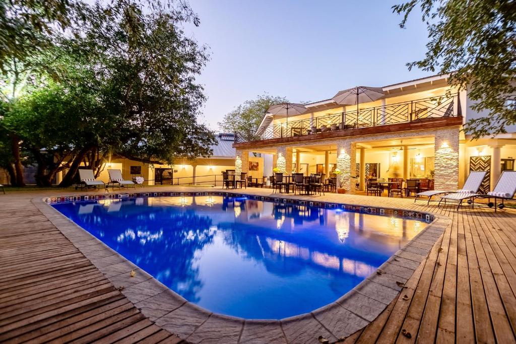 Lodge pool and terrace at dusk