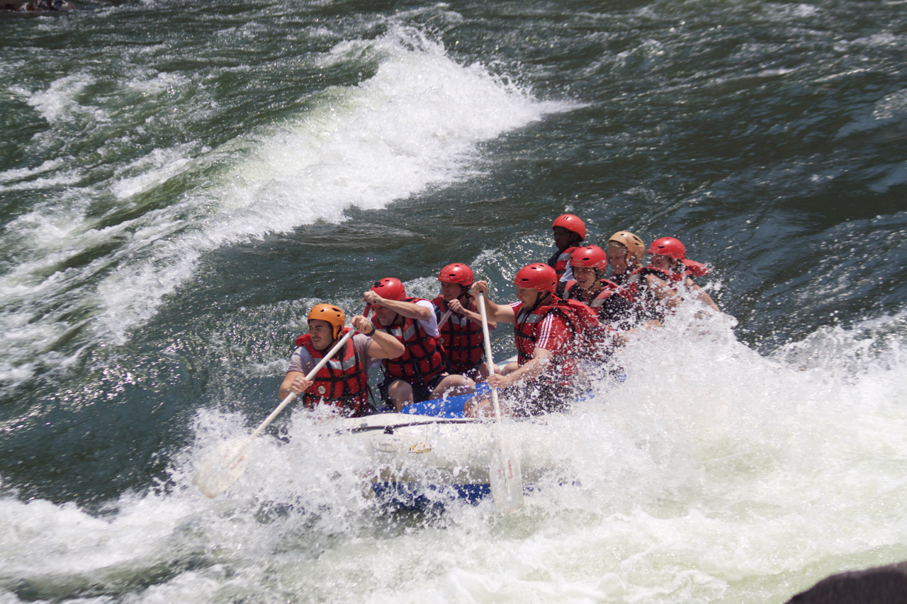 Rafters paddling through white-water rapids on the Zambezi