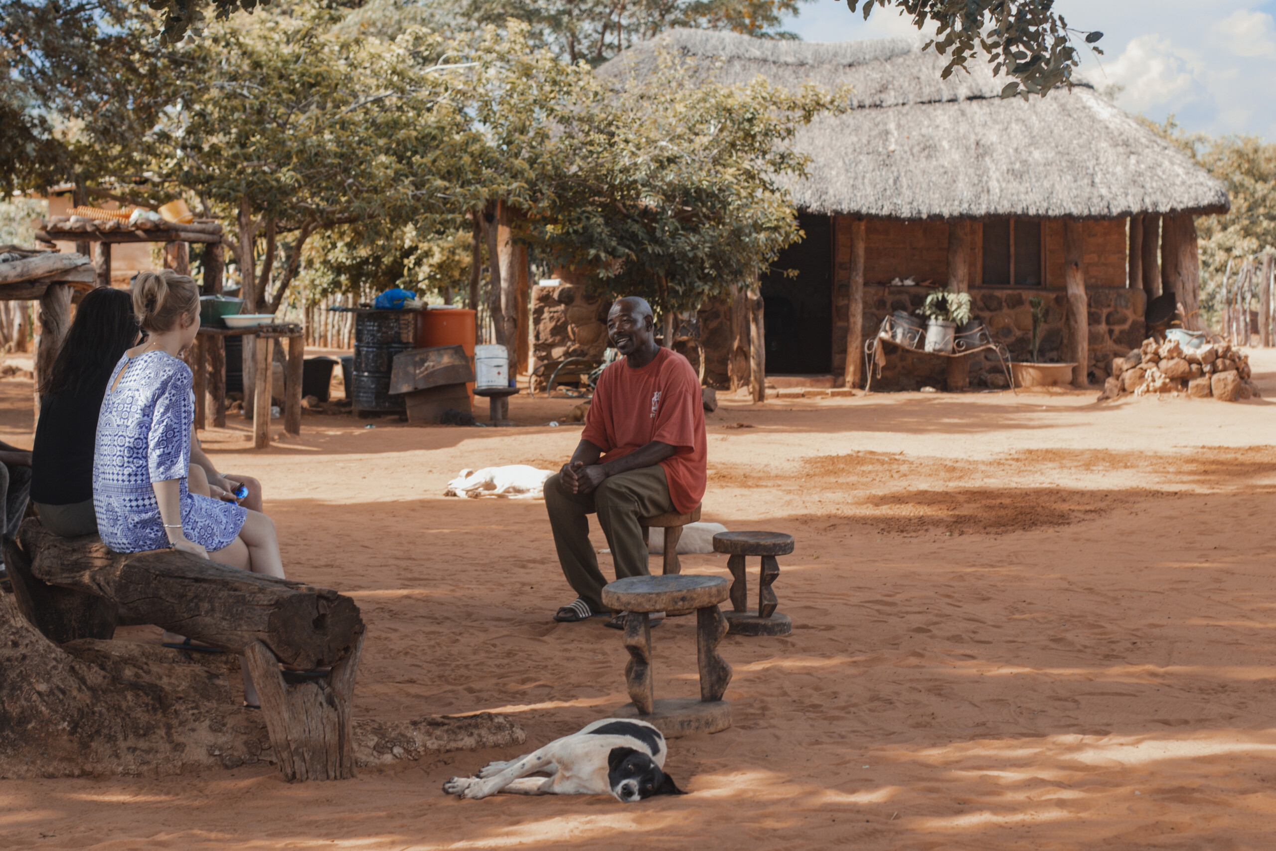 Visitors meeting a local resident in a village
